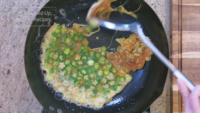 Once the egg is set, flip and pan-fry the other side until browned and crispy (adjust cooking time to your preference). Keep stirring and breaking the egg into smaller pieces.
