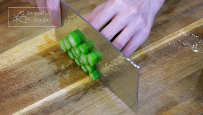 Discard the stem ends of the okra and cut into 1/4-inch thick pieces.