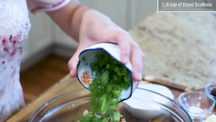 Combine the smashed shrimp, pork, mushrooms, egg, scallions, cornstarch, soy sauce, oyster sauce, sugar, garlic, ginger, and sesame oil in a bowl. Mix until sticky.