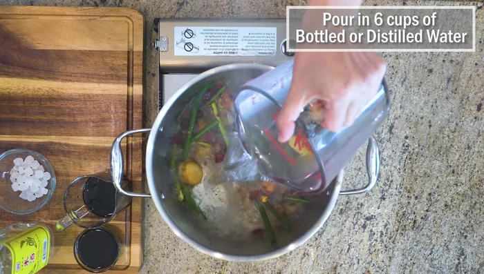 Pour in 6 cups of bottled water (do not use tap water). Bring to a boil.