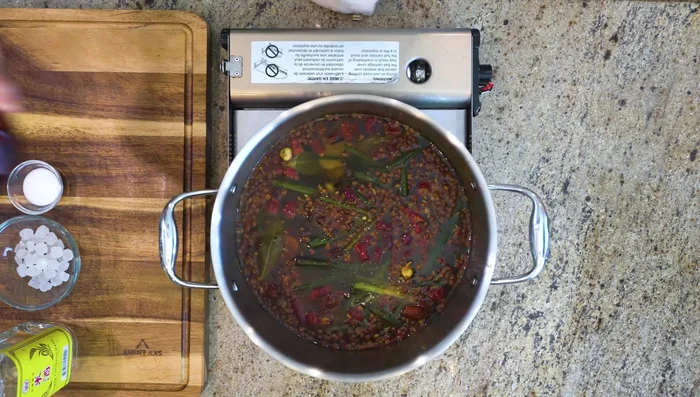 Add soy sauce, dark soy sauce, Chinese cooking wine, rock sugar, and salt.