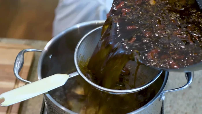 Strain the brine to remove solid ingredients. Bring the liquid back to a boil.