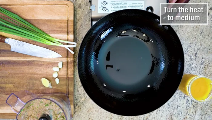 Prepare the broth: Heat vegetable oil in a wok over medium heat. Add sliced scallions, ginger, and garlic. Stir for 1 minute. Add squash puree and stir for a minute. Add chicken stock and mix well.