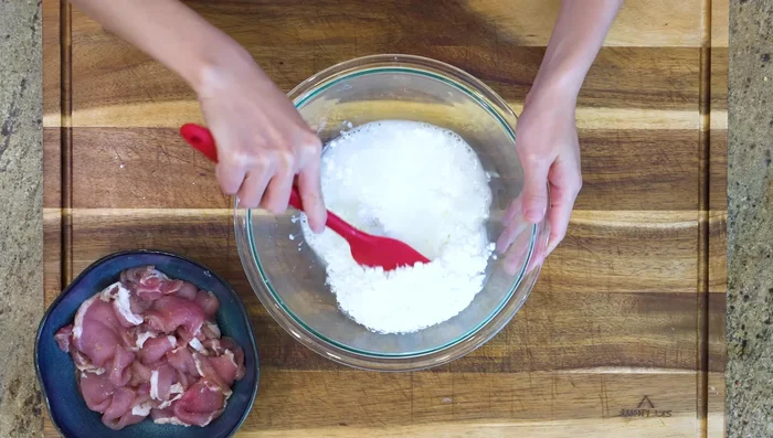 Make sweet and sour pork: Double-fry pork, coat in sweet and sour sauce.