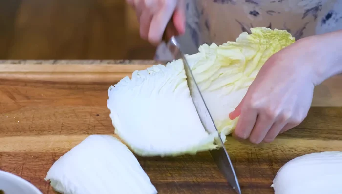 Prepare daikon cabbage: Remove outer leaves, cut stem into thin slices.