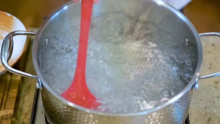 Cook the dumplings: Bring a pot of water to a boil, create a vortex, and gently add the dumplings. Poach for 6-7 minutes, swirling the water to prevent sticking. (663.36)
