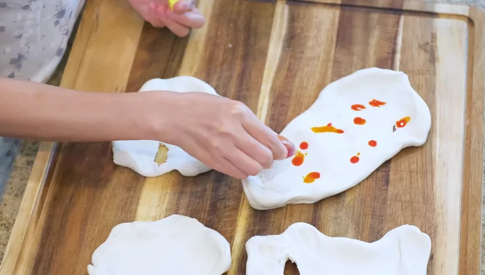 Divide the dough into four pieces and color them if desired (125.52).