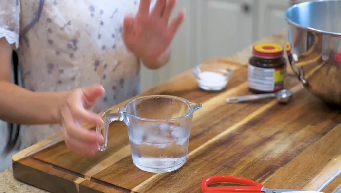Prepare the dough: Mix ice water, sugar, and yeast. Let it sit in the fridge for 5 minutes (21.279).