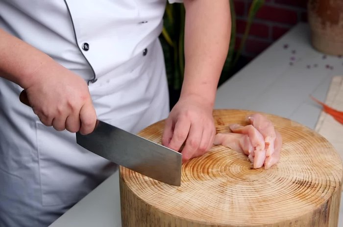 Prepare the chicken: Cut into bite-sized pieces. Marinate with spices (refer to specific recipe for details).