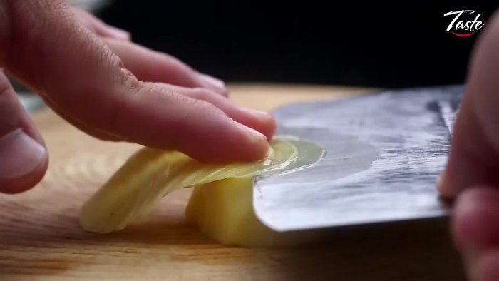 Initiate the cutting process, demonstrating precise knife skills.