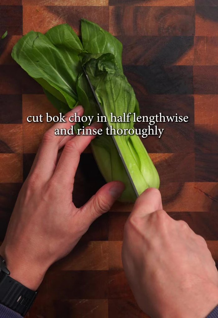 Cut bok choy in half lengthwise, rinse thoroughly (changing water three times), and drain.