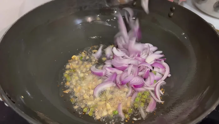 Add onions and fry lightly.
