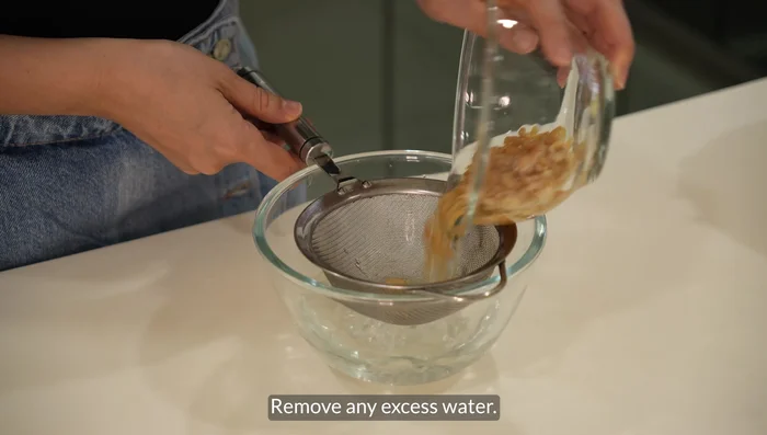 Drain excess water from dried shrimps. Ensure they are dry to prevent oil splattering.