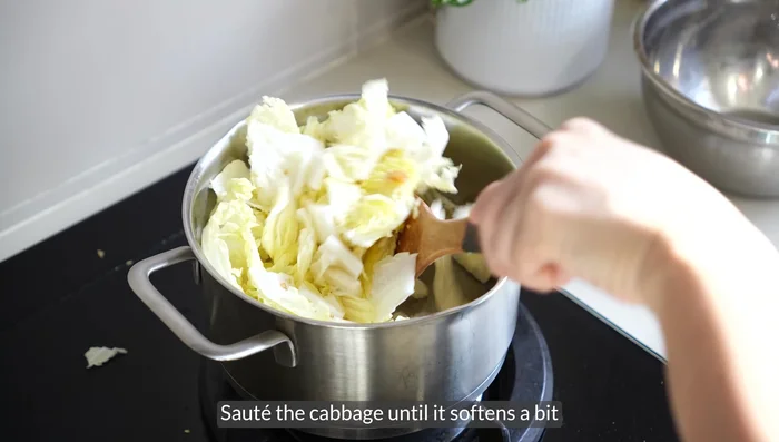 Add vegetables and sauté until cabbage softens.