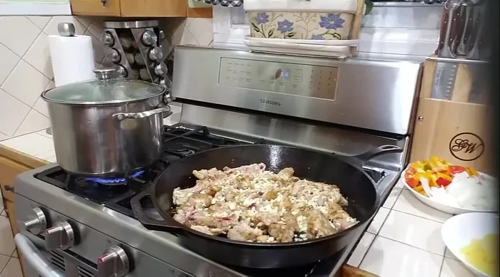 Add garlic, ginger, and 1 teaspoon of sesame oil to the chicken while it's cooking.