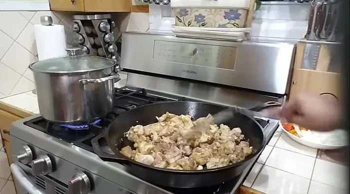 After 3-4 minutes of cooking, add the prepared sauce to the chicken and cook for another 2 minutes.