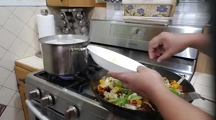 Add scallions, stir, and turn off the heat. The residual heat will continue to cook the vegetables.