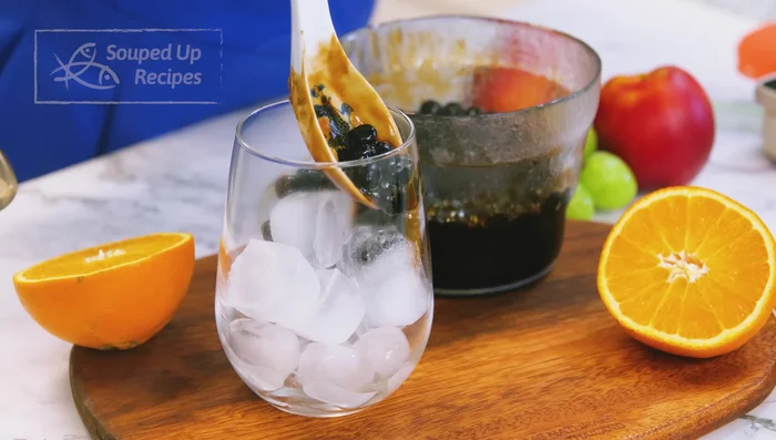 Assemble the boba tea: Add tapioca pearls to a cup, ensuring they touch the sides for presentation. Pour in the milk tea.
