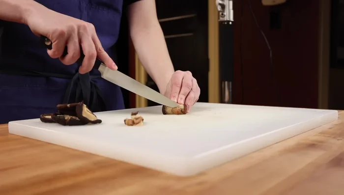 Prepare mushrooms and lilies: Slice shiitake mushrooms, discarding tough stems. Prepare wood ear mushrooms and lilies by removing tough ends and slicing lilies in half.