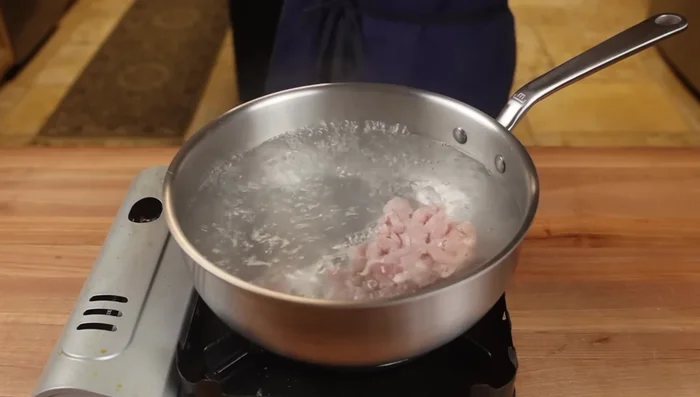 Par-cook protein and bamboo shoots: Simmer meat in lightly salted water until almost cooked (2-3 minutes). Blanch bamboo shoots for 30-60 seconds.