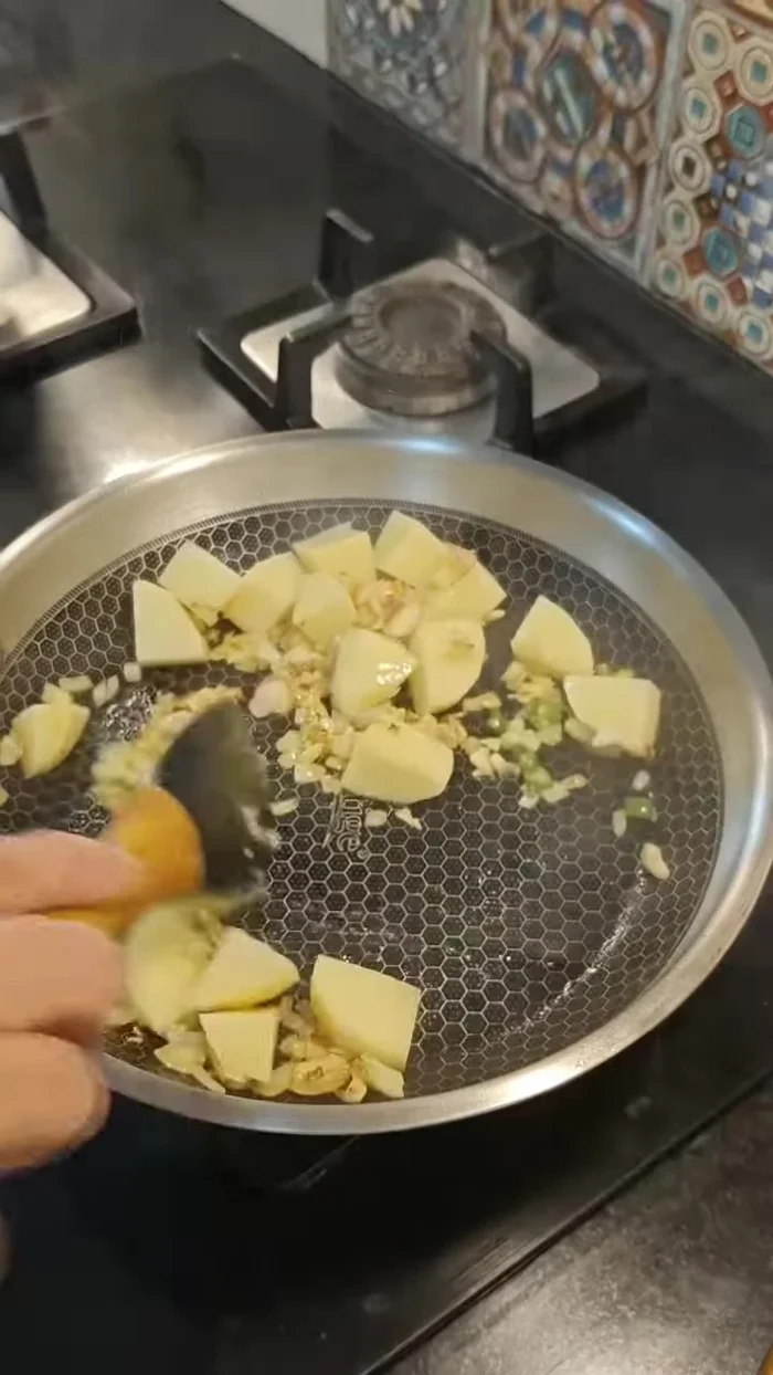Add potatoes; fry on medium-high heat, then reduce heat and cook covered, adding water as needed. (Alternatively, microwave potatoes for about 3 minutes).