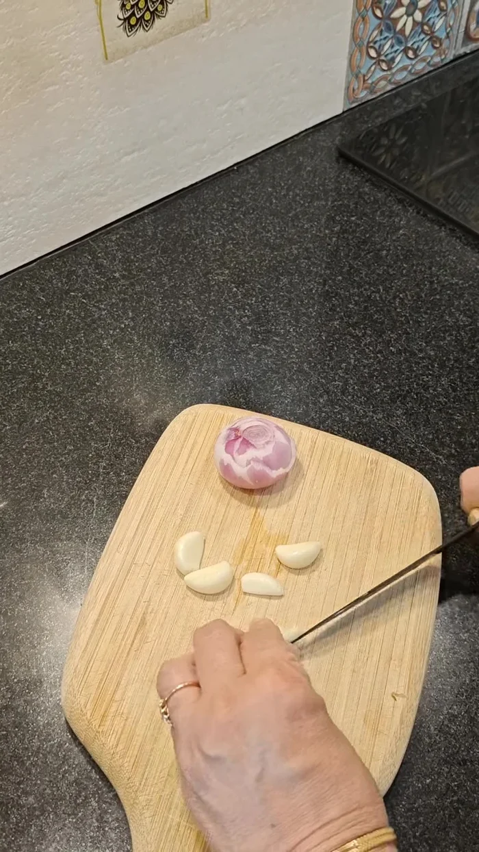 Finely chop onion, garlic, and green chili.