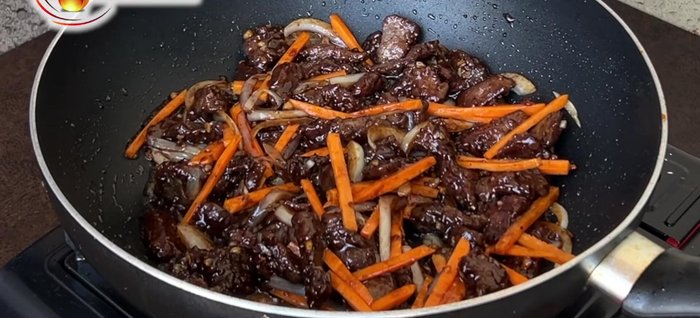 Add vegetables: Add carrot strips and optionally green beans. Then, add the Chinese cabbage (Baguio pechay). Stir-fry for another 5 minutes. Vegetables can be left slightly crunchy.