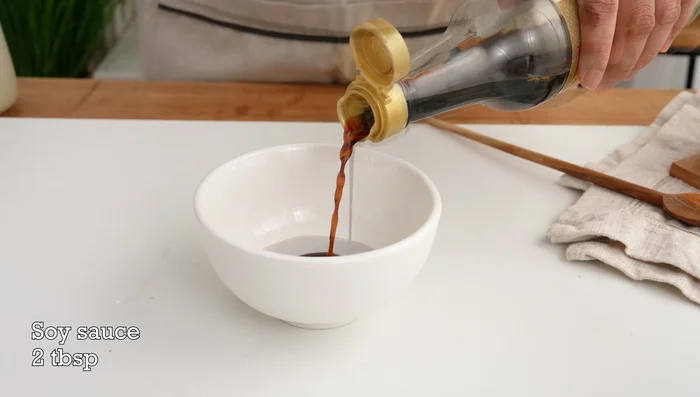 Prepare the sauce: Combine light soy sauce, dark soy sauce, white wine, sugar, and water in a bowl. In a separate bowl, mix cornstarch with water to create a slurry.