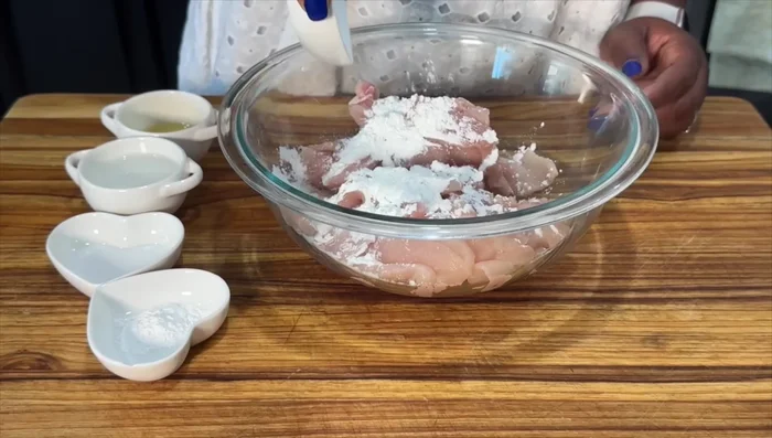 Marinate chicken with cornstarch, baking soda, salt, water, and avocado oil.