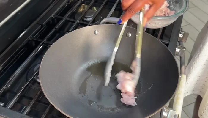 Heat avocado oil in a wok or skillet. Cook chicken in batches to avoid overcrowding.